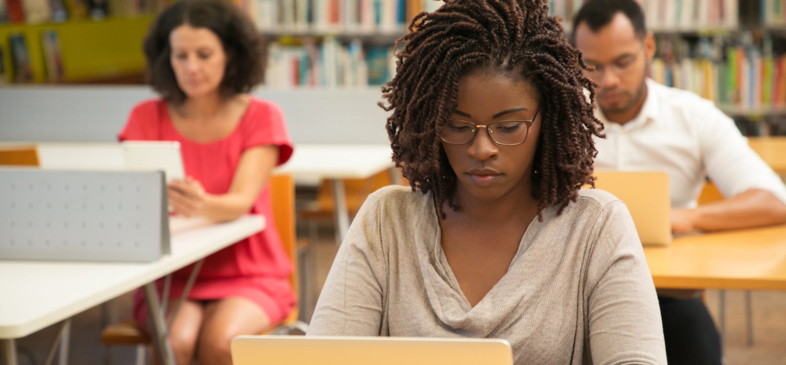 American Student Studying at Library